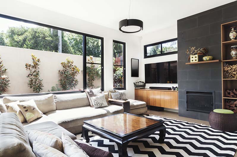 Modern living room with black vinyl windows