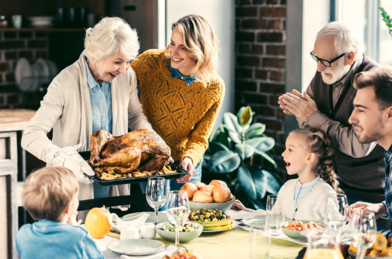 Family celebrating Thanksgiving at home